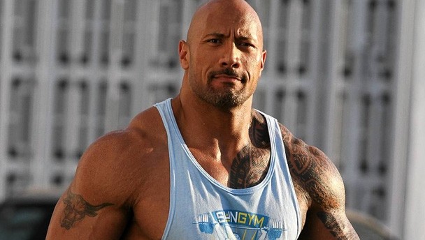 The Rock flexing (https://www.google.com/url?sa=i&rct=j&q=&esrc=s&so ())